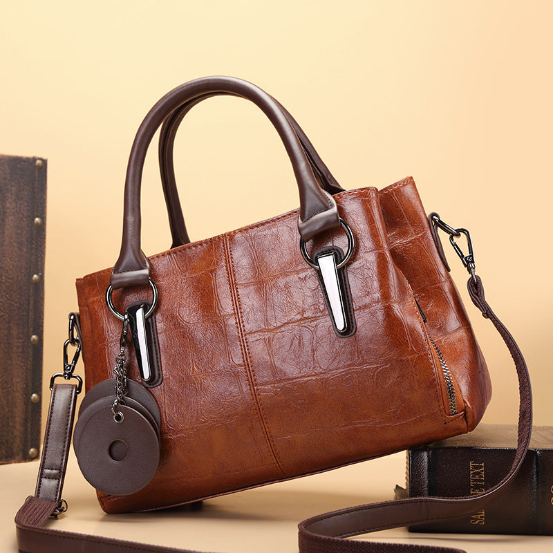 Bolsa de mano femenina estructurada con diseño elegante