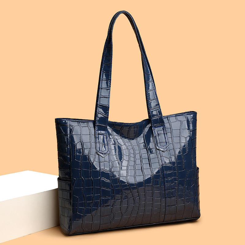 Bolsa tote femenina de acabado texturizado elegante