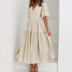 Kelly - Vestido estilo elegante con escote en V y mangas abullonadas